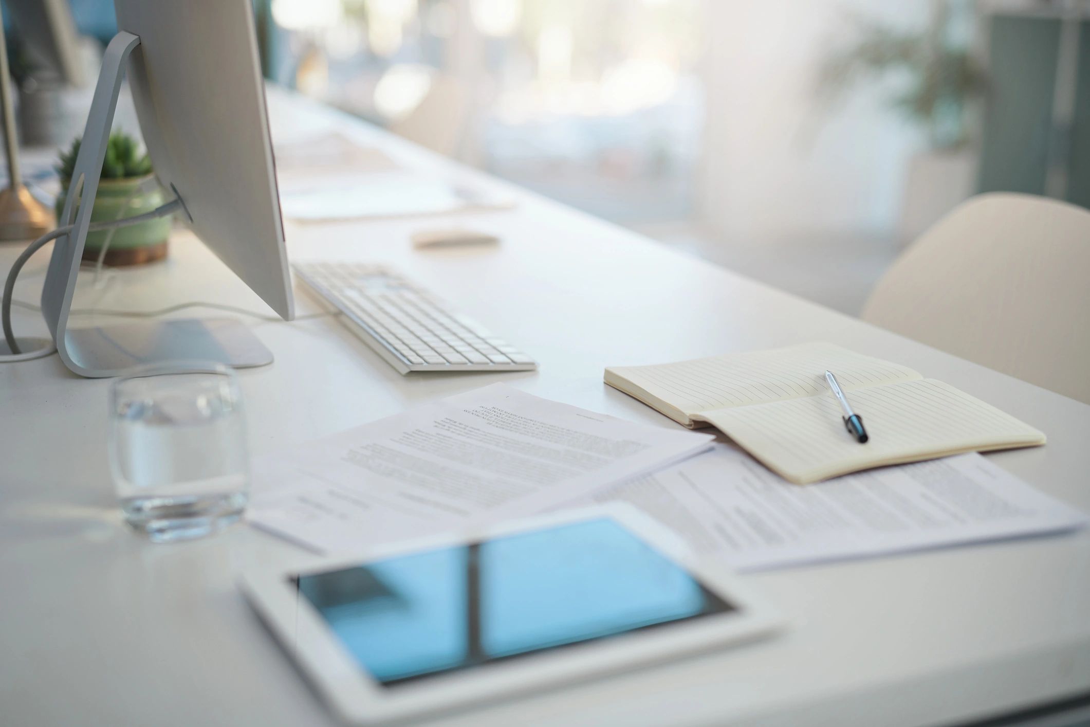 Office desk with documents representing compliance records and planning