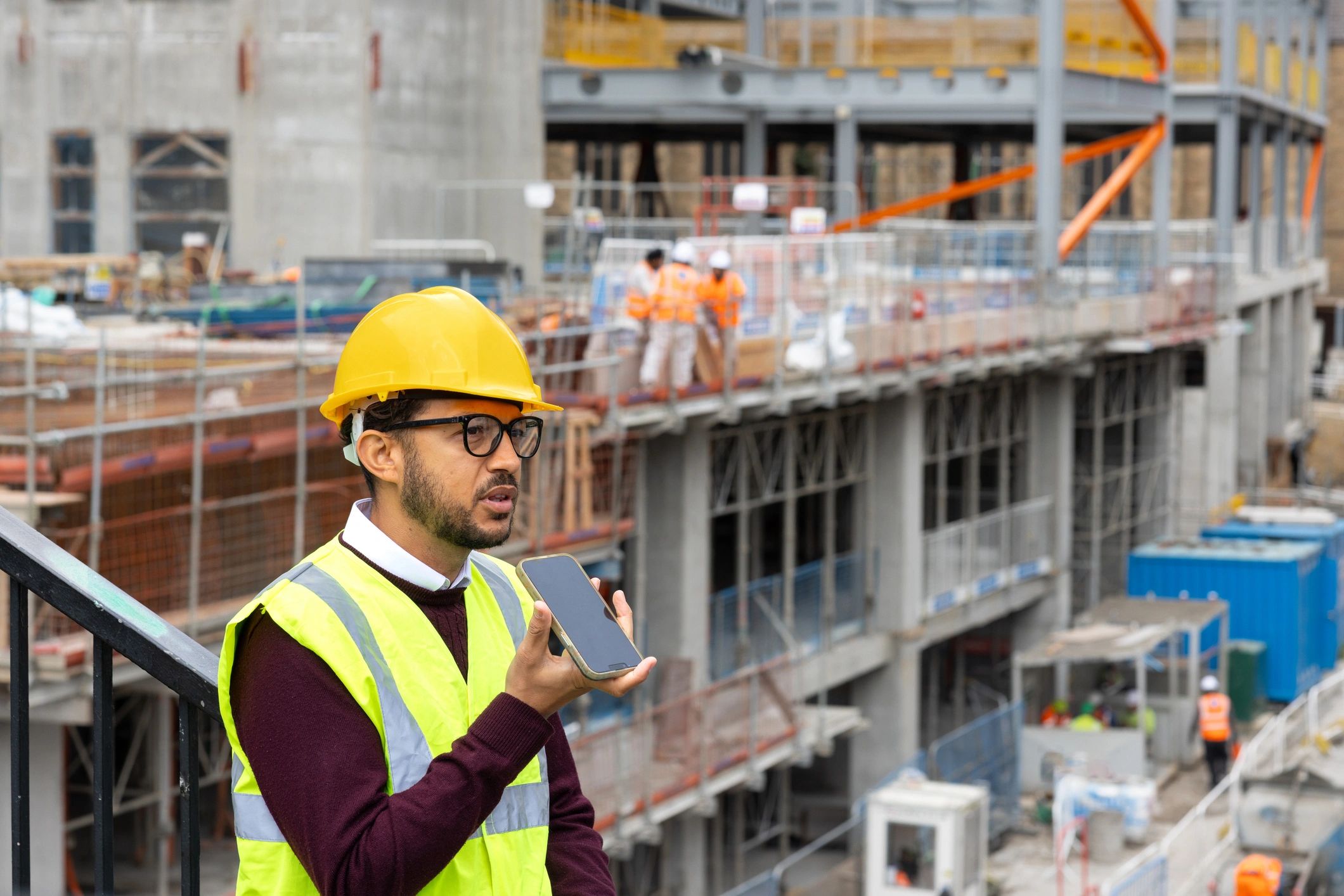 Site supervisor using a tablet on a construction project